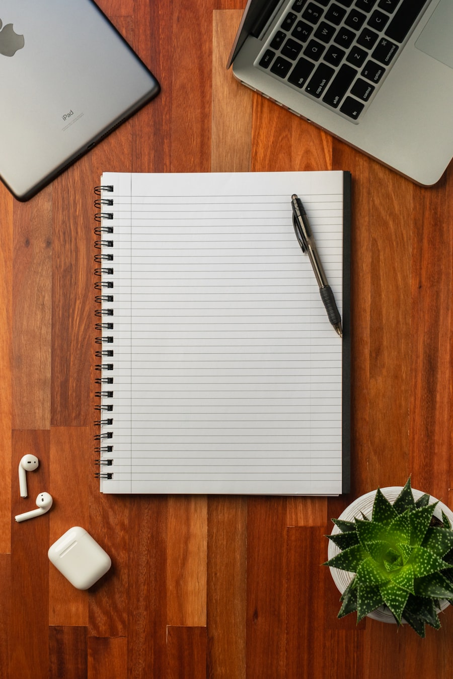 Notebook and planning materials representing direct mail strategy